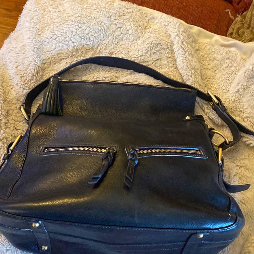 Florentine Dooney and Bourke leather and brass handbag. With long strap.